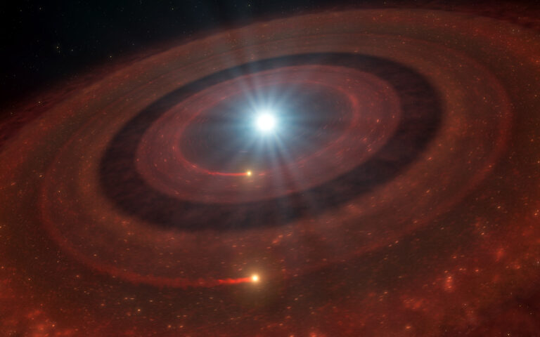Rappresentazione artistica dei due anelli attorno alla nana bianca J1328−1450 — ESO/L. Calçada